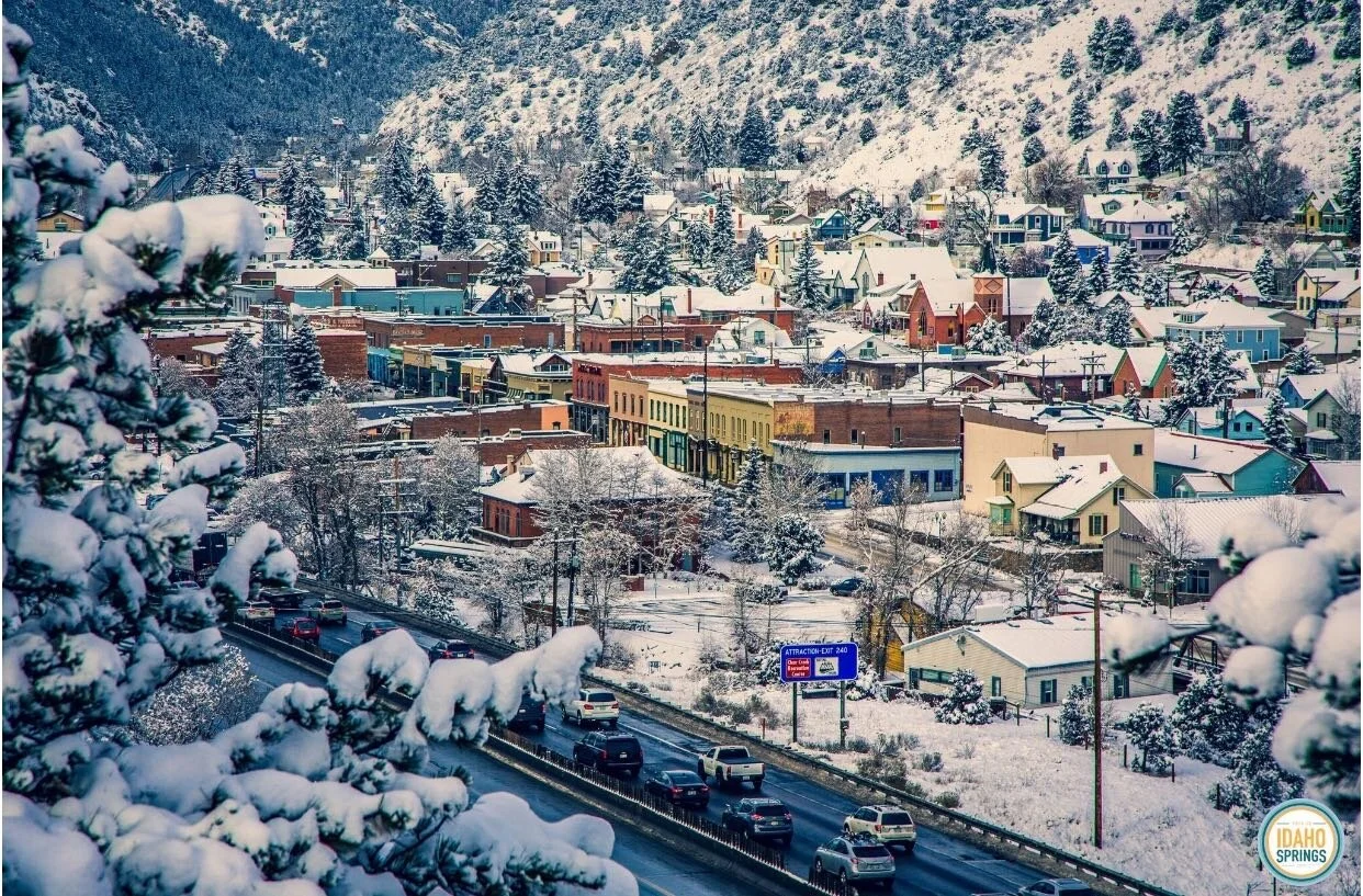 Snow-dusted downtown Idaho Springs, Miner Street and Clear Creek tucked into the canyon